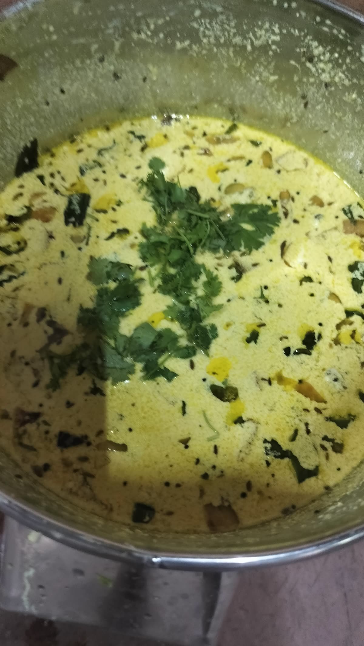 A vessel of kurma finished with coriander