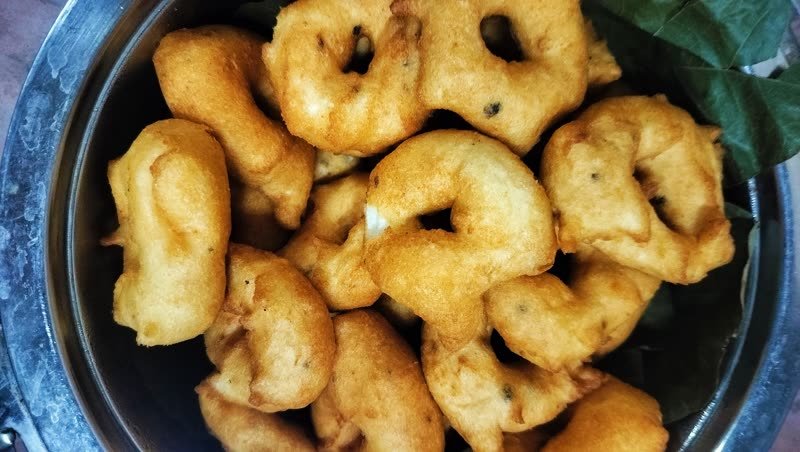 Vadai in a large steel vessel