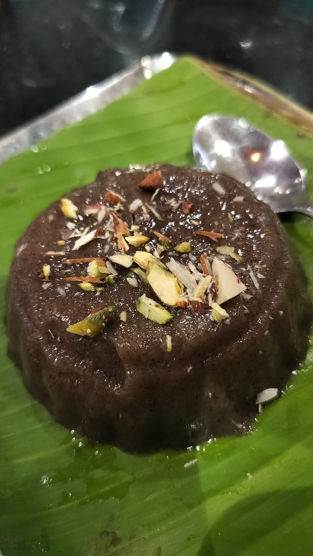A sweet served on a banana leaf